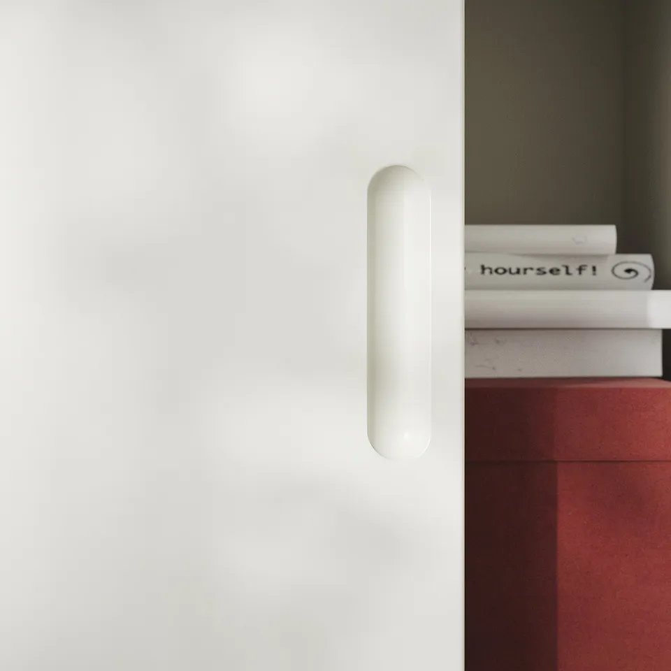 Off-white TONSTAD cabinets sliding door with cylindrical handle, featuring minimalist design.
