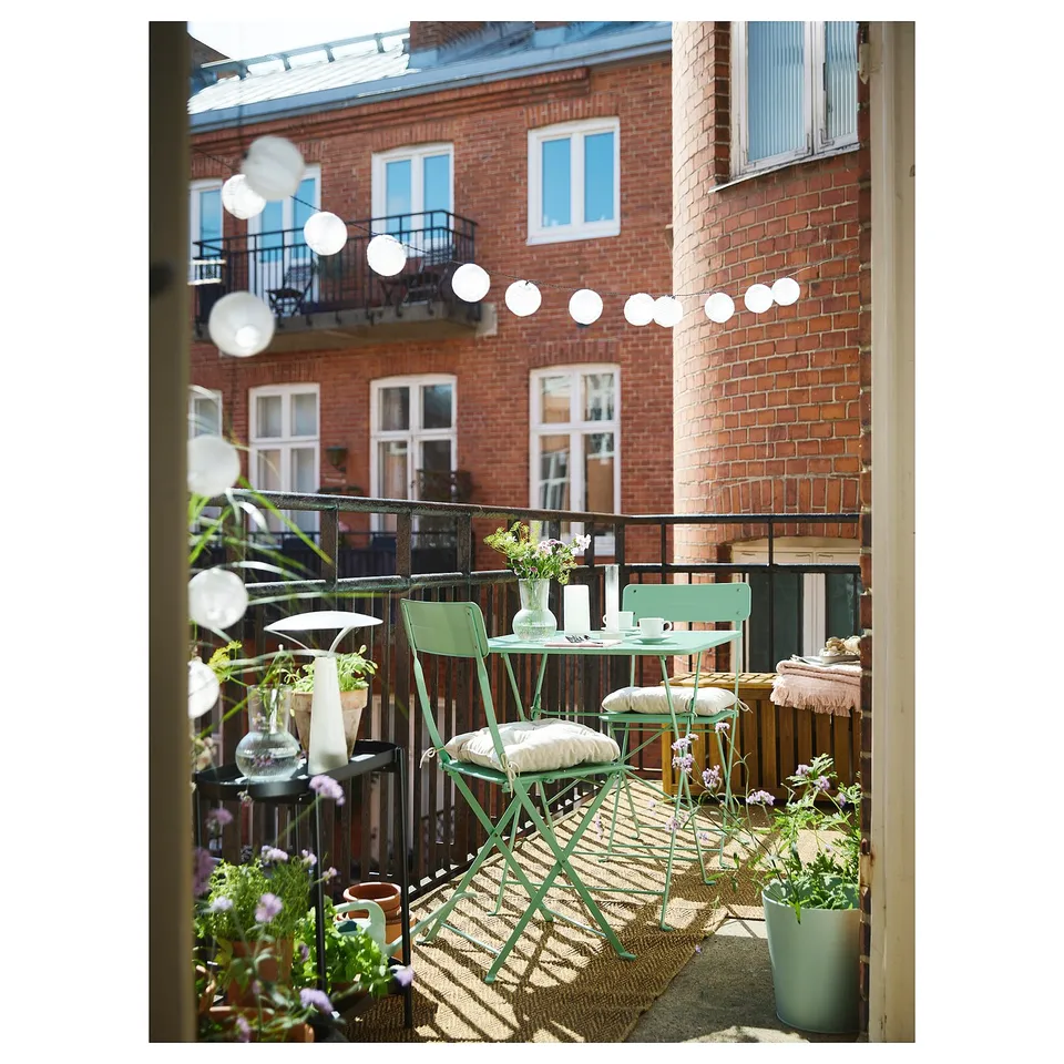 SUNDSÖ Folding chair, light green outdoor