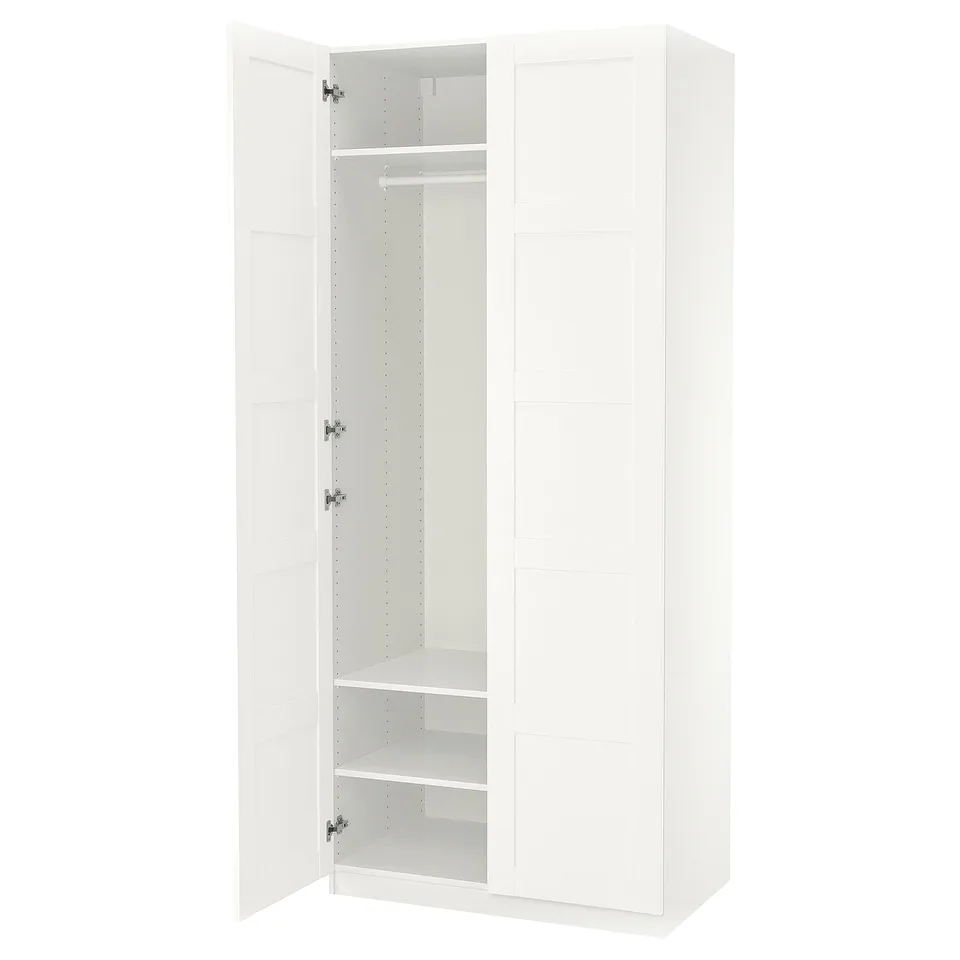 White PAX wardrobe, minimalist design, three compartments, hanging rail, two shelves, soft-close doors.