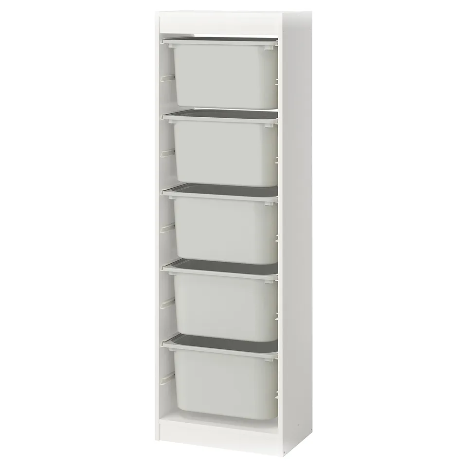 White TROFAST storage unit with five plastic bins in white, rectangular shape, for organising items.