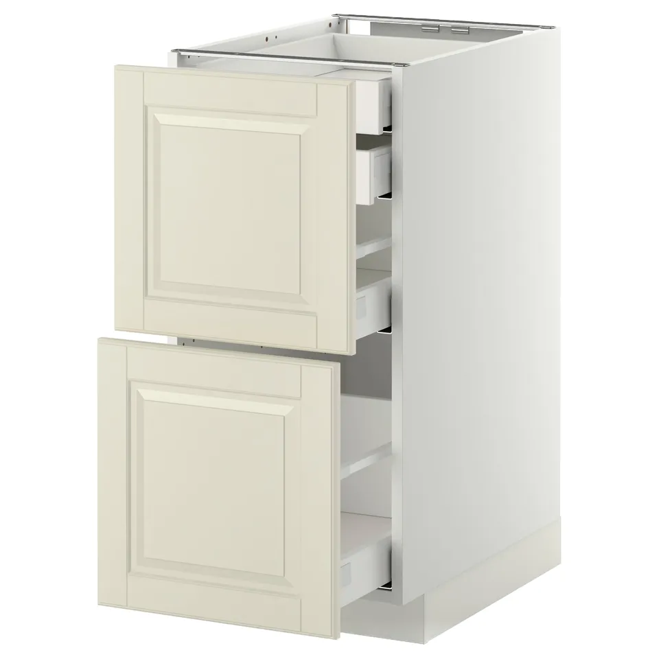 White METOD kitchen cabinet with off-white bodbyn drawers, smooth and modern, featuring bevelled edge pull-out drawers.