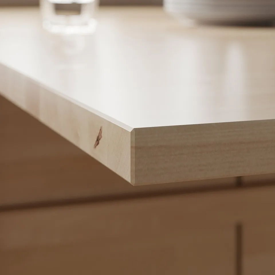 White, sleek edge of modern table top with clean finish.