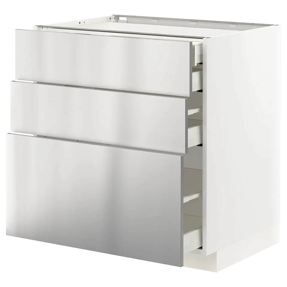 A white METOD kitchen cabinet with stainless-steel drawers. The modern design includes three large drawers with a sleek, industrial aesthetic.