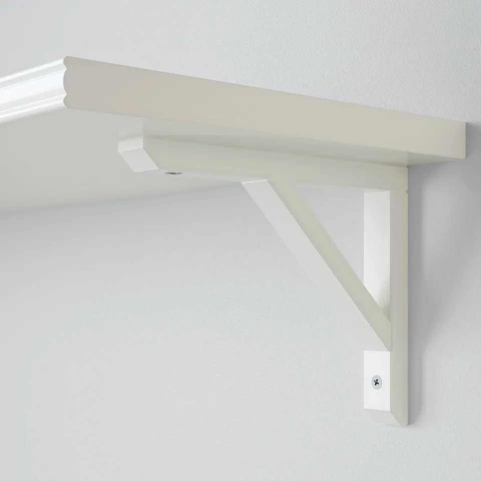 Modern white wall shelf with sleek design, securely mounted on a pristine wall. High-quality finish, combining particle board and solid wood.