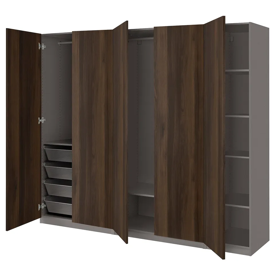 An open wooden wardrobe, the PAX. It has shelves, drawers, and hanging space.