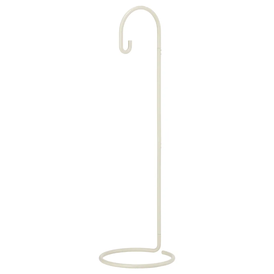 A SOLVINDEN solar lamp in beige with a curved hook. Its sleek, modern with a minimalist design, made of powder-coated steel.