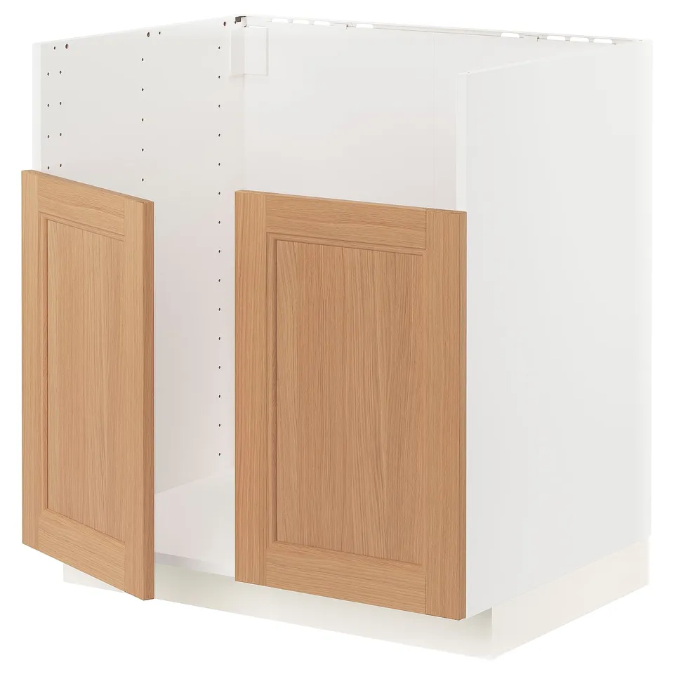 White METOD kitchen cabinet with oak doors and wooden base.