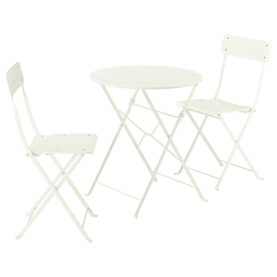 A SUNDSÖ set, featuring a small white round table and two foldable chairs. Perfect for balconies or compact spaces.