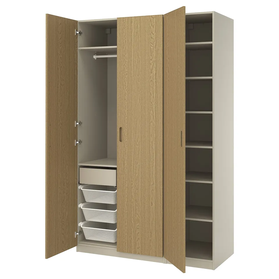 A light wooden PAX wardrobe with open doors, shelves, and drawers.