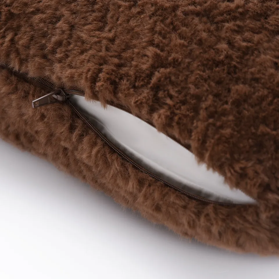 Fluffy brown cushion cover with zip, made from recycled polyester for easy cleaning.