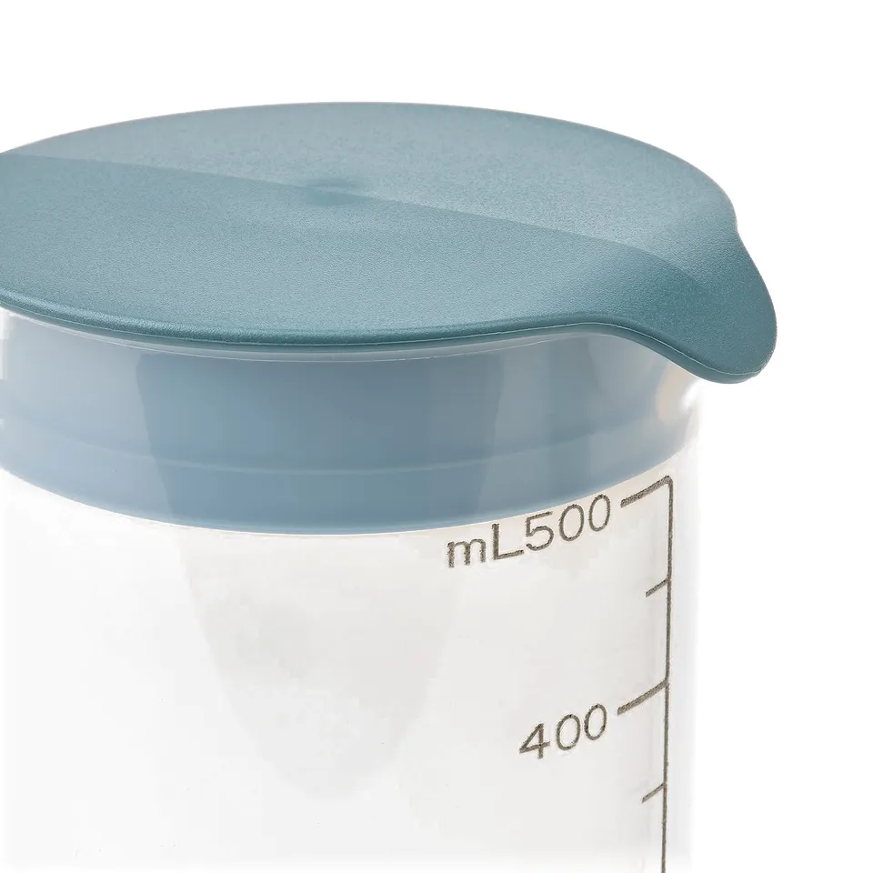 A clear plastic shaker bottle with a blue leak-proof lid and measurement markings up to 500 ml, ideal for mixing and storing liquids.