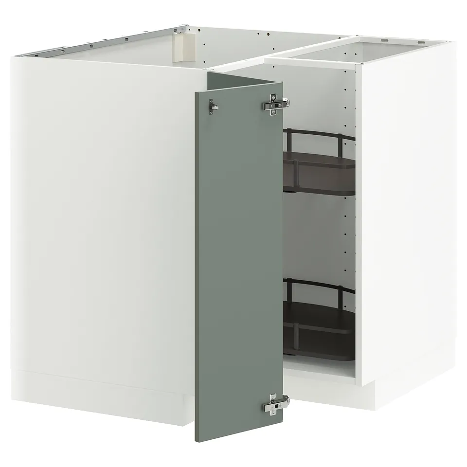 Modern white kitchen cabinet with green door, holding black shelves. Its a METOD unit with adjustable storage.