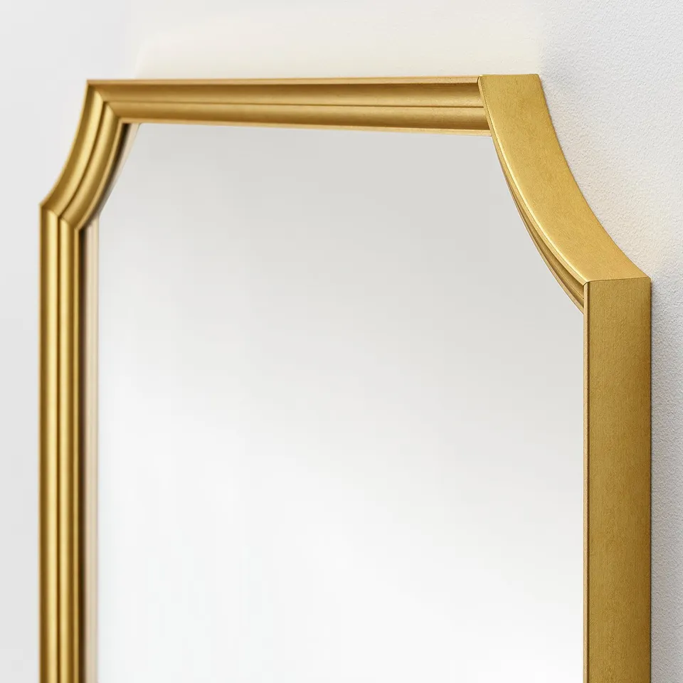 Elegant gold-framed mirror with sleek design. Quality reflective surface, ideal for modern decor.