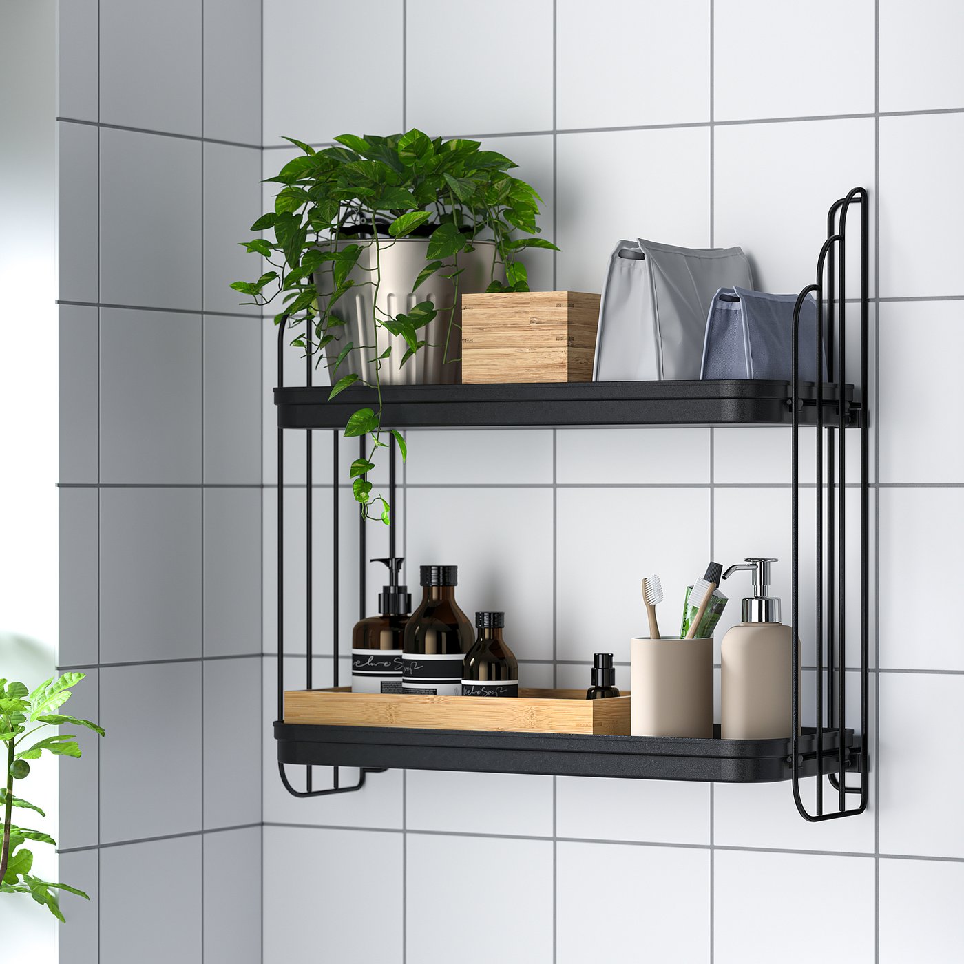 Black metal wall shelf holds plants, bathroom essentials, and storage bags in bathroom.