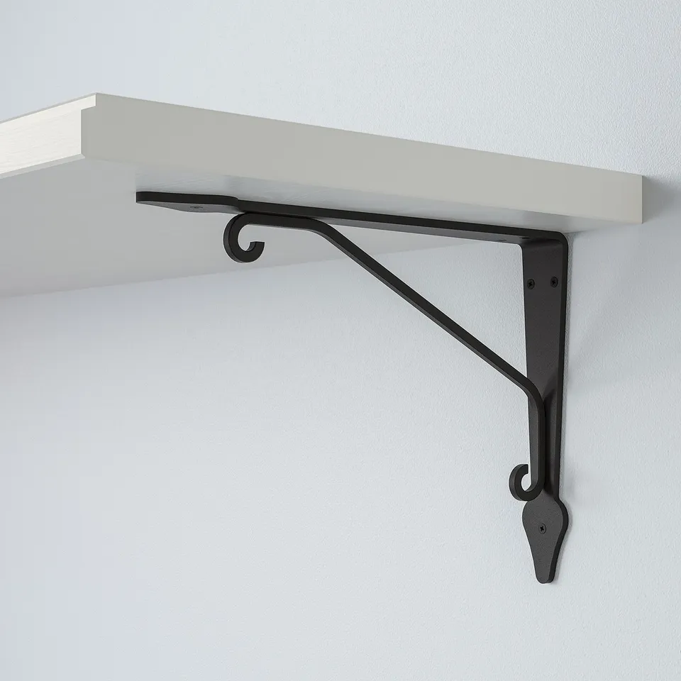 White wall shelf with black metal bracket. Simple, sturdy, modern design. Wall-attached, ready for use.