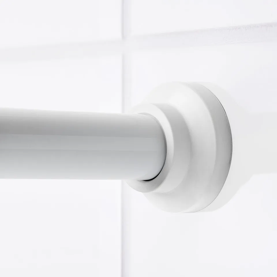 Close-up of modern shower curtain rod, extending mechanism. Sleek white finish, securely attached to wall.