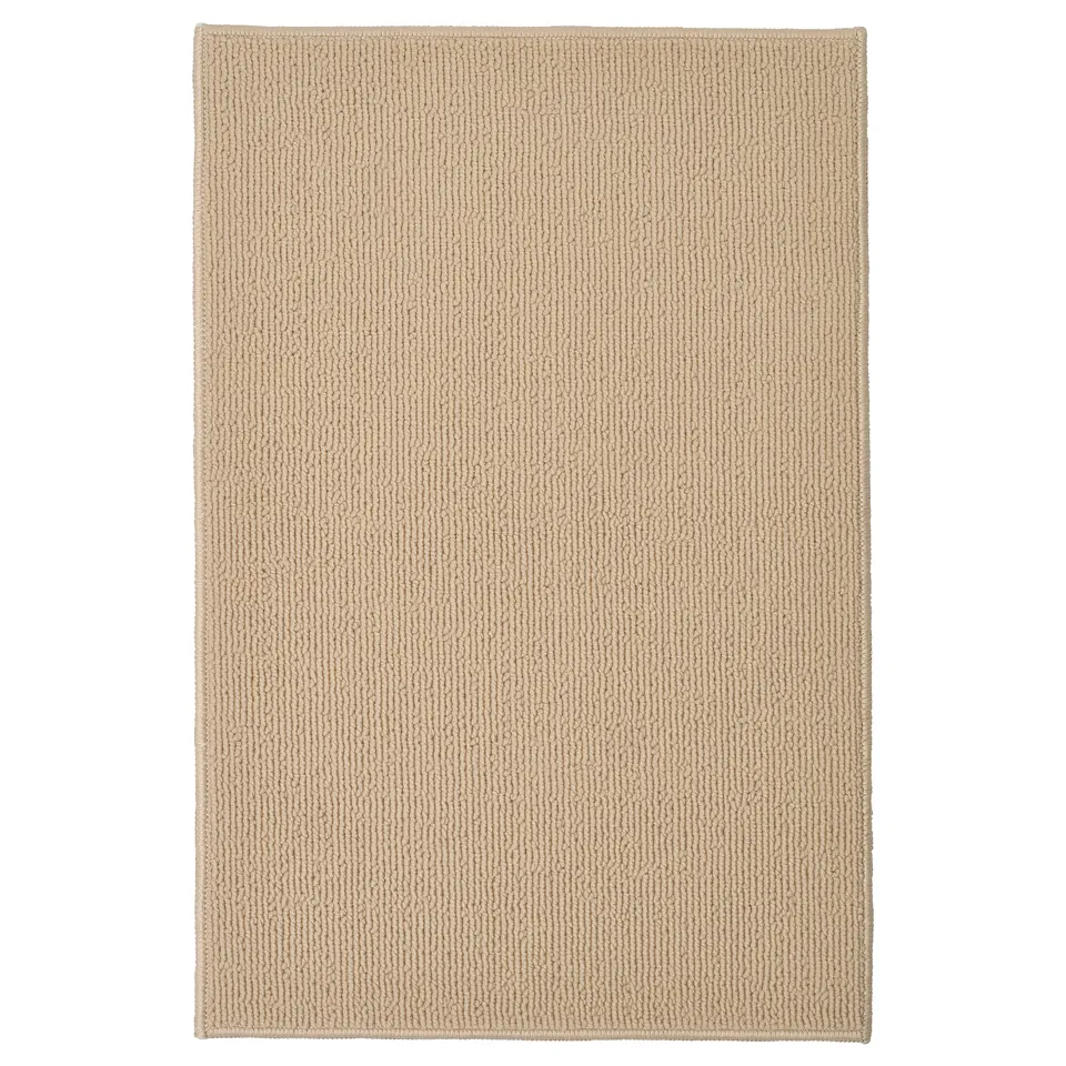 FINTSEN beige bath mat, rectangular, textured, recycled polyester.