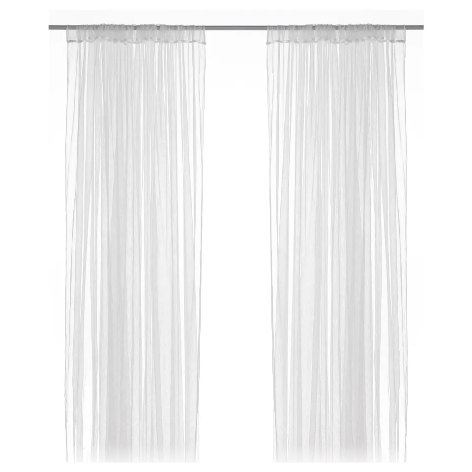 White LILL sheer curtains, semi-transparent, hang straight with simple top design, made from recycled polyester.