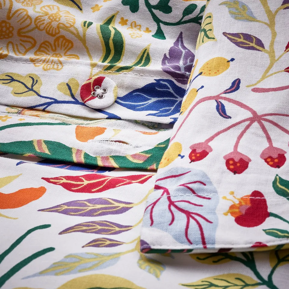 Vibrant floral duvet set, slub cotton for texture, natural & breathable. Button closure shown.
