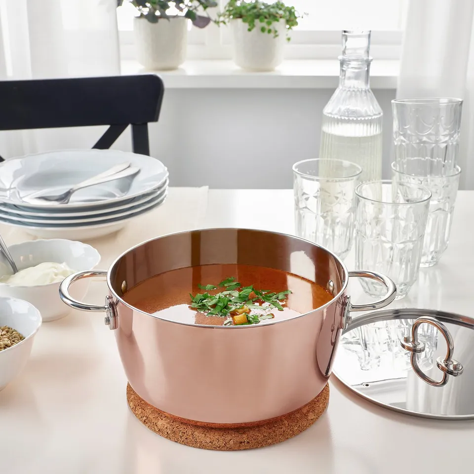 Table set with FINMAT soup, plates, glasses, cutlery.