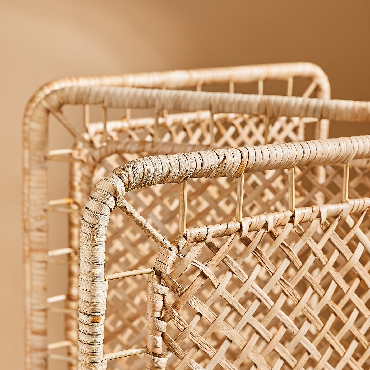 Close-up of intricately woven natural rattan, showcasing the detailed craftsmanship of a TOLKNING room divider.