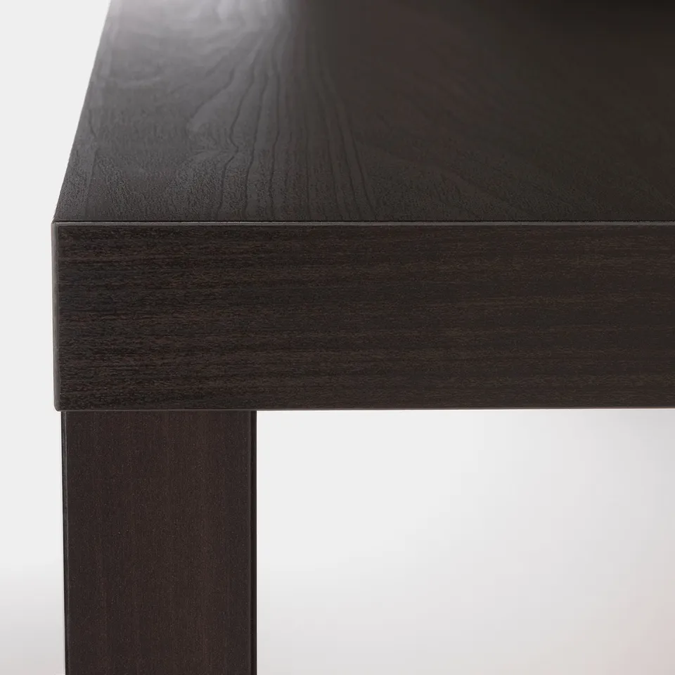 Dark wooden table corner, smooth finish, strong joinery, sleek edge detail.
