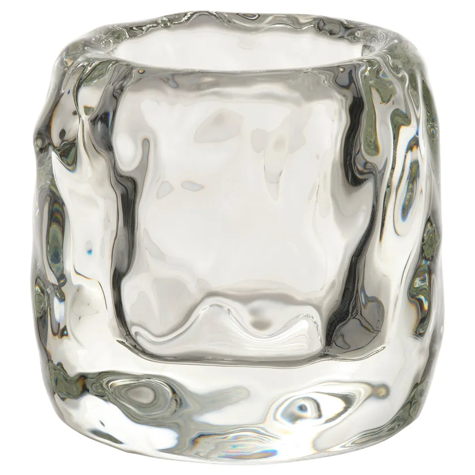 STOCKHOLM 2025: clear glass tealight holder, ice cube shape, thick design.
