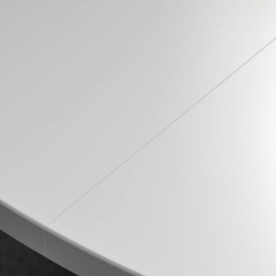 A clean, modern white table top, part of a round conference table, indicating high-quality materials and sleek design.
