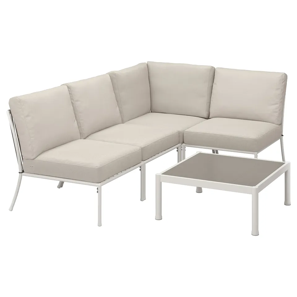 Modern minimalist outdoor sectional sofa, white metal frame, beige cushions, angled corner design, paired with a matching coffee table.