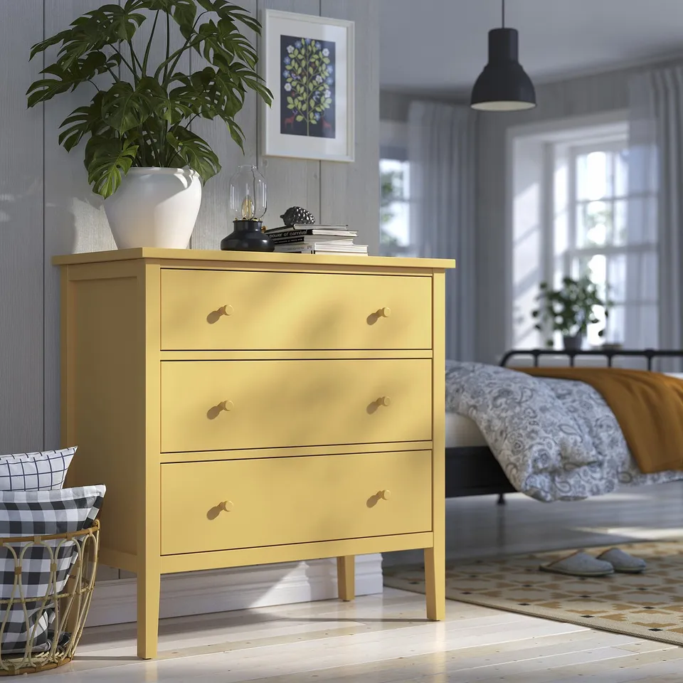 Yellow GULLABERG dresser with plant, bedroom setting