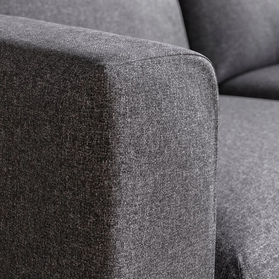 Close-up of plush, grey cushioned sofa, showcasing smooth fabric texture, highlighting comfort and durability.