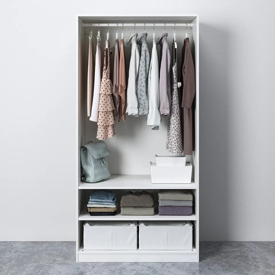 Closet organiser with hanging garments, folded clothes, and storage bins.