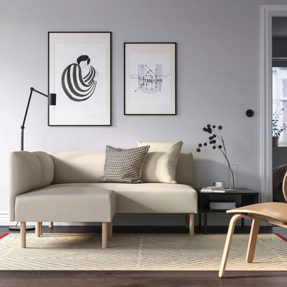 Modern living room with LILLEHEM sofa, art, lamp, table, and rug.