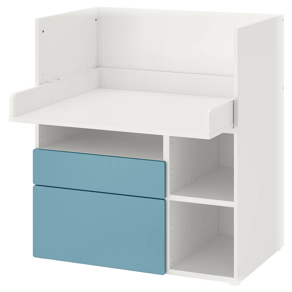 White and blue kids desk with drawers, open shelves.