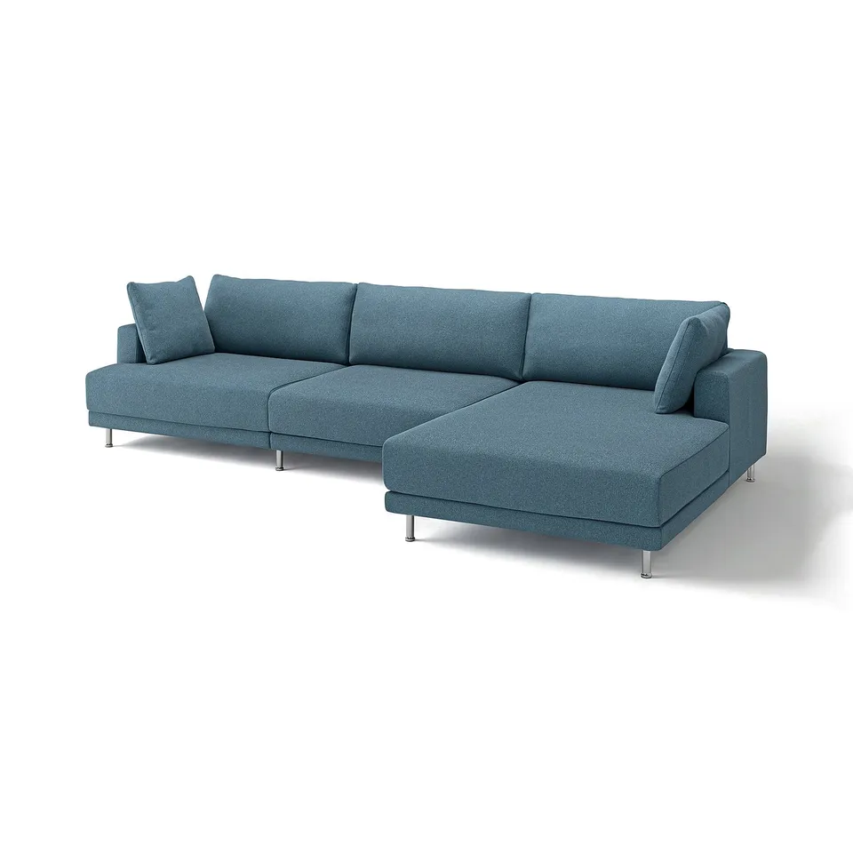 An UPPÅKRA sectional sofa in blue with a modern design. It a chaise lounge end and supportive cushions. The legs are metal and chrome-plated.