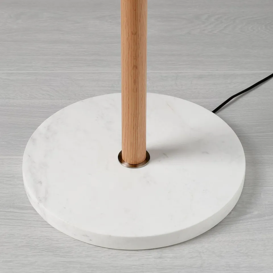 Modern lamp with marble base and wooden stem, quality materials, elegant design.