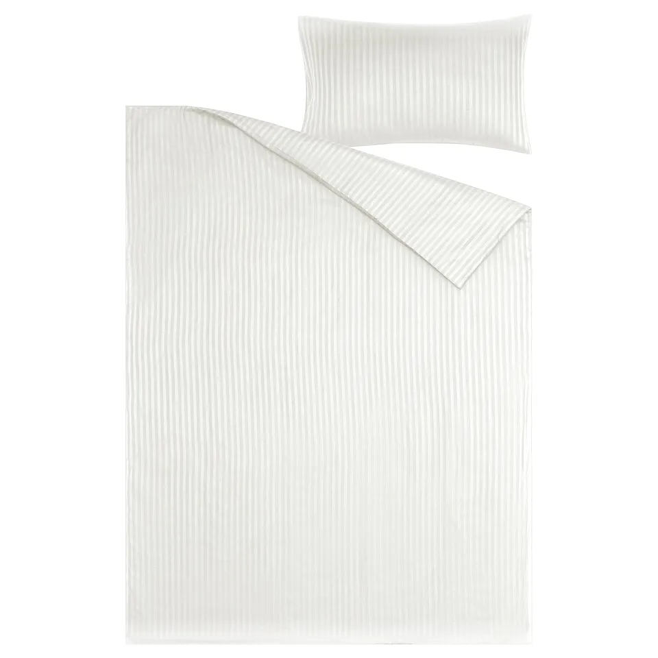 A white NATTJASMIN duvet cover set with subtle stripes in cotton/lyocell blend. Includes one rectangular duvet cover and one pillowcase.