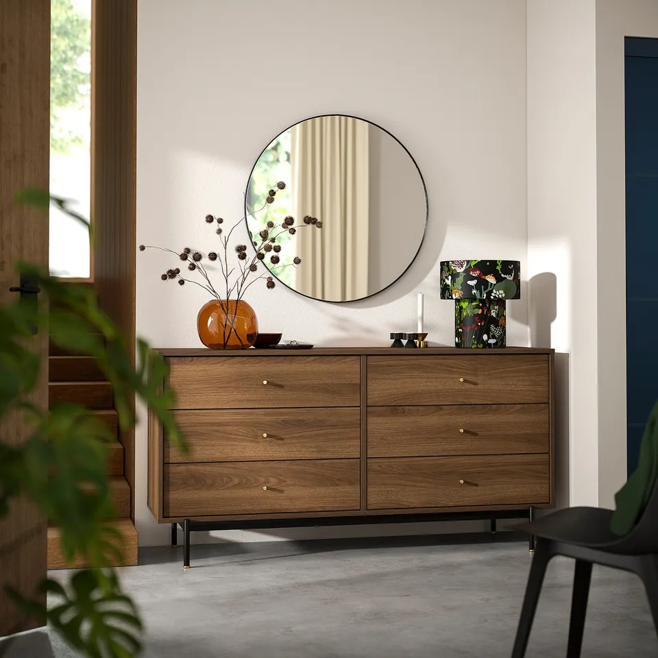 RÅDMANSÖ chest: 6-drawer, walnut-brown dresser. Brass knobs, black legs, mirror, decor.