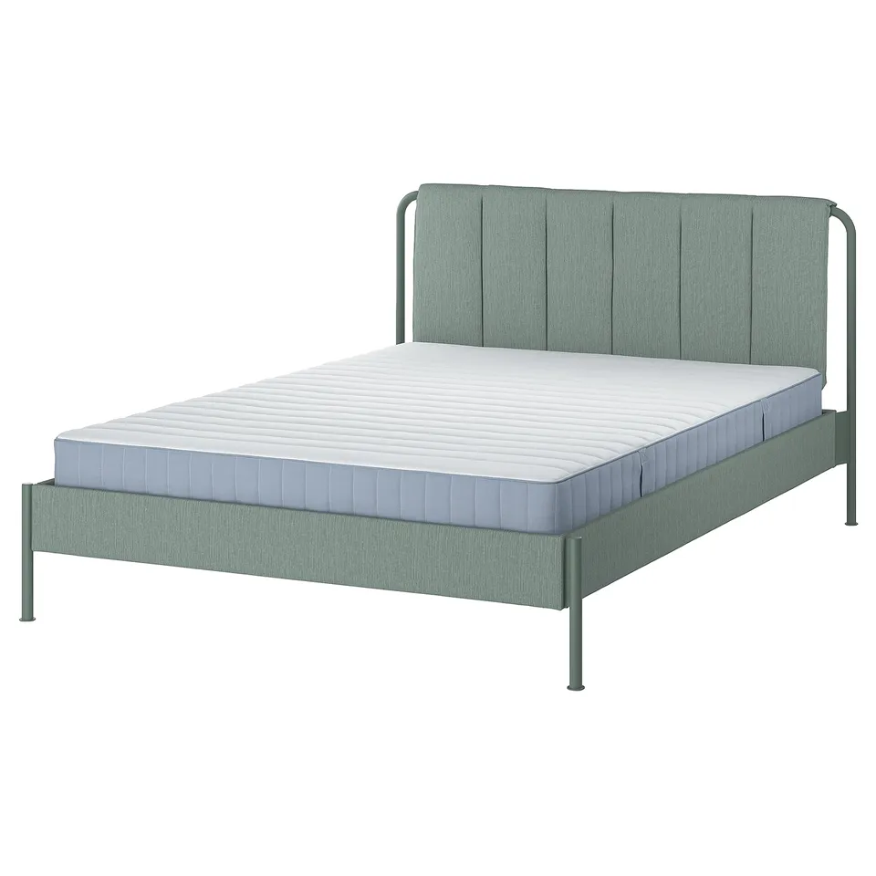 A TÄLLÅSEN bed in grey-green with a metal frame and padded headboard, featuring a modern design and upholstered fabric.