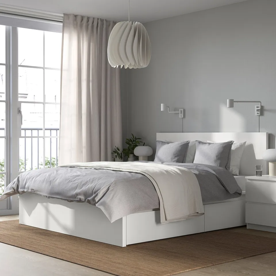 Modern bedroom with MALM bed and plants.