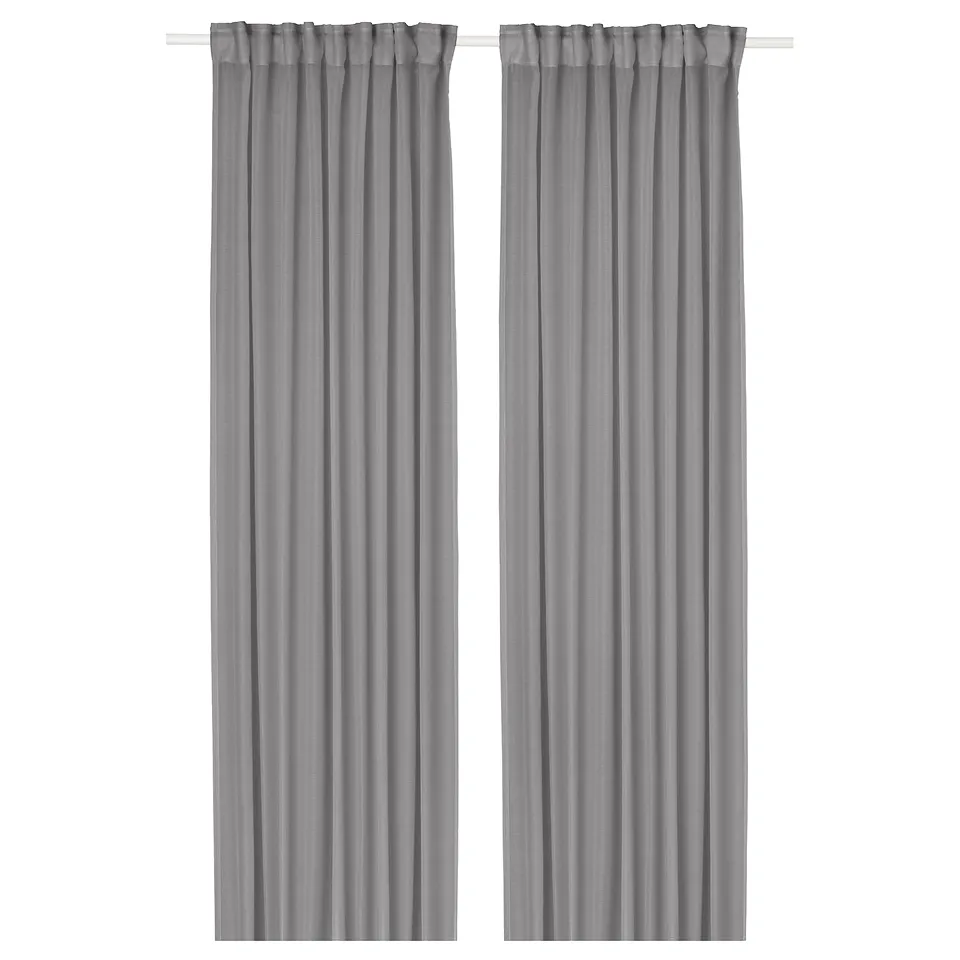 Two grey STENFRÖ sheer curtains hang straight and neat, designed with recycling polyester material for an elegant and eco-friendly window dressing.
