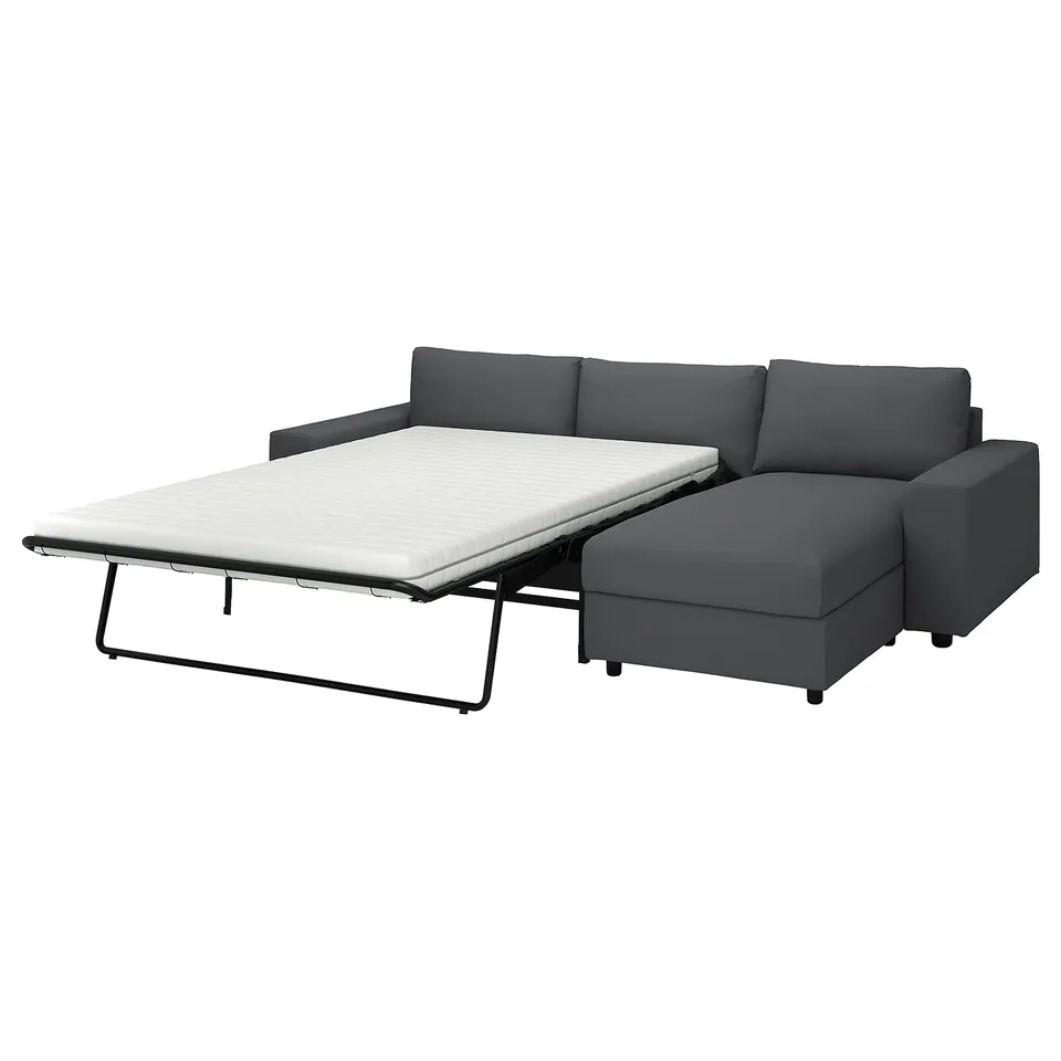 A dark grey VIMLE sectional sofa-bed with a pull-out bed and storage chaise longue.