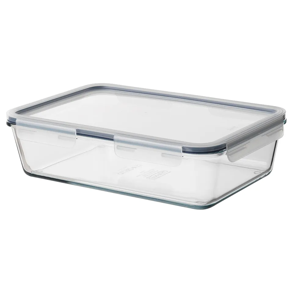 An IKEA 365+ clear glass food container with a locking lid, designed for storing and transporting meals.