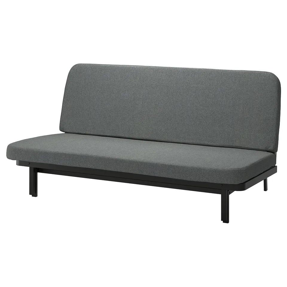 Displays a grey NYHAMN sofa-bed with a sleek, modern design. It a steel frame, a click-mechanism for conversion, and under-seat storage.
