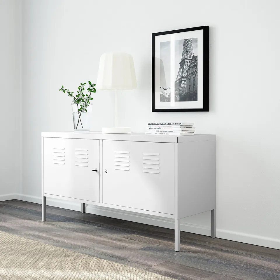 White metal cabinet with lockable doors, neat design, suitable for storing personal items securely.