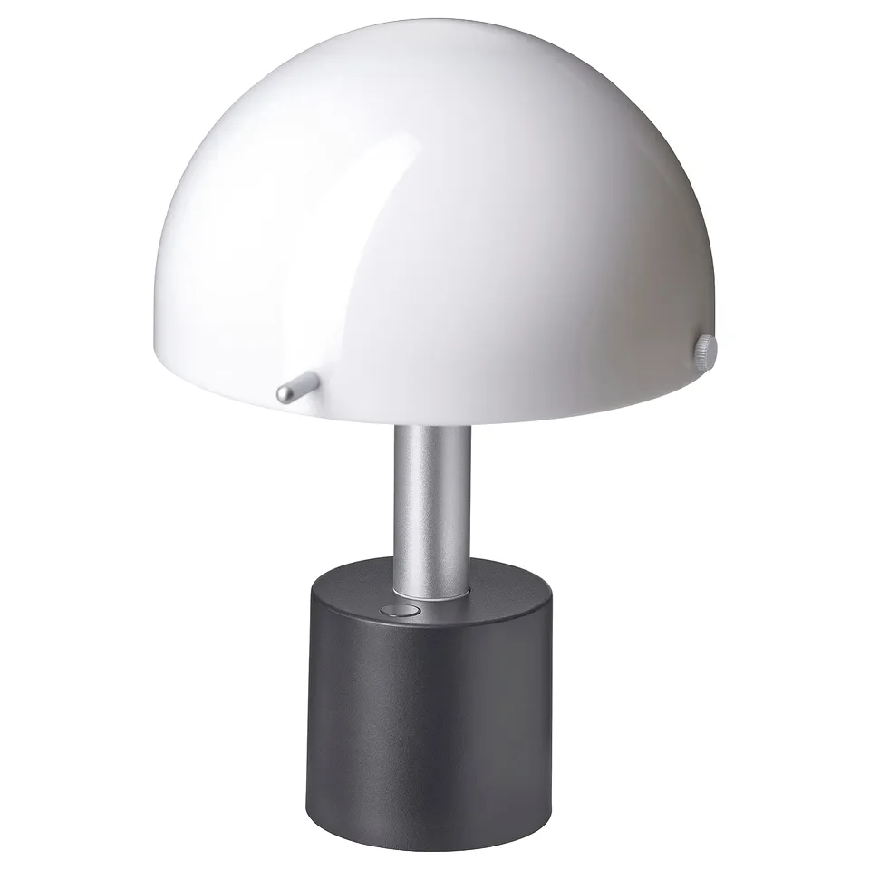 NÖDMAST: compact, portable lamp with white shade, slender stem, and grey base for cosy lighting.