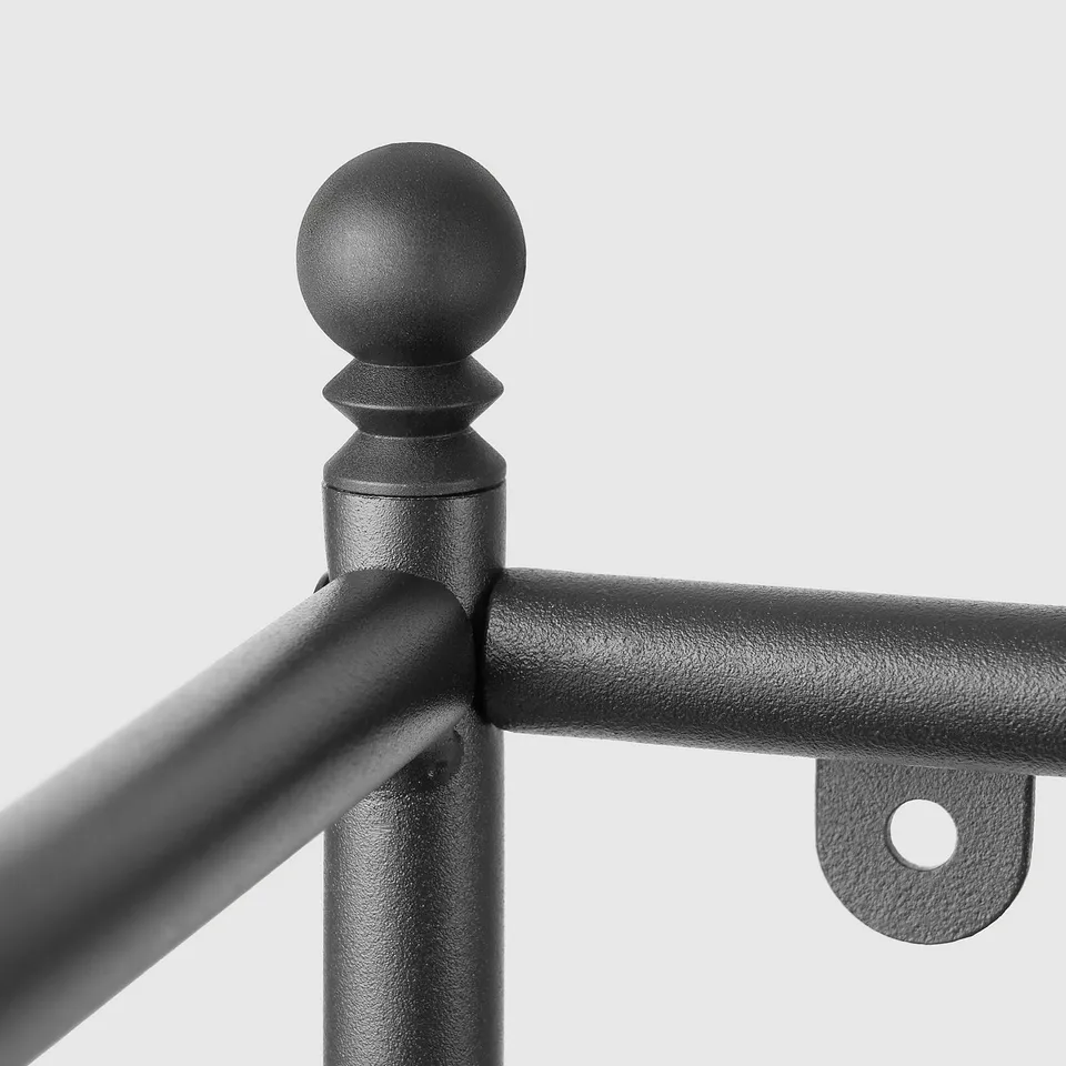 Black metal rod with spherical tip, part of durable bathroom storage.
