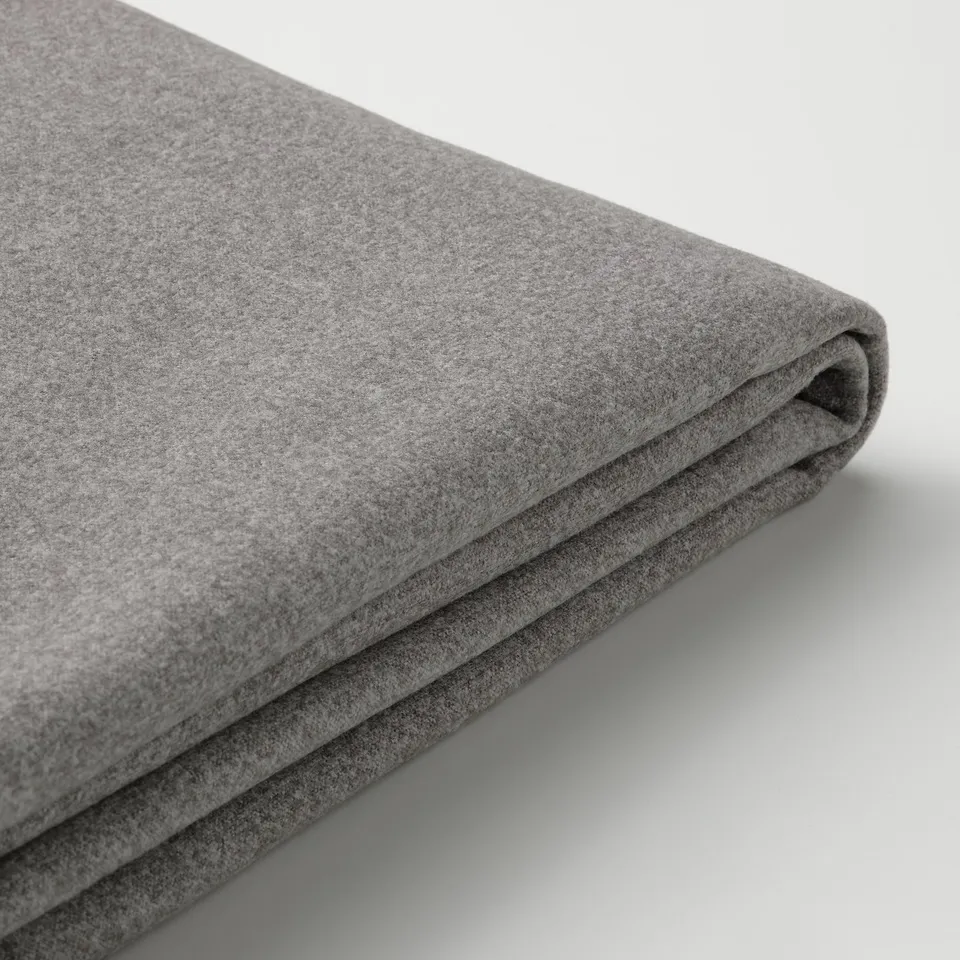 Folded grey fabric, smooth texture, high-quality sofa cover.