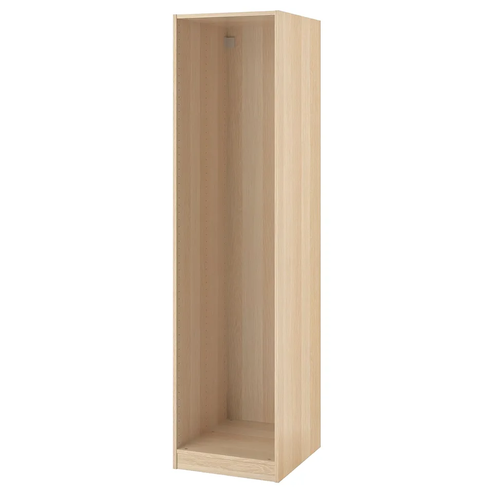 Light-colored ikea PAX wardrobe frame with adjustable feet for custom storage.