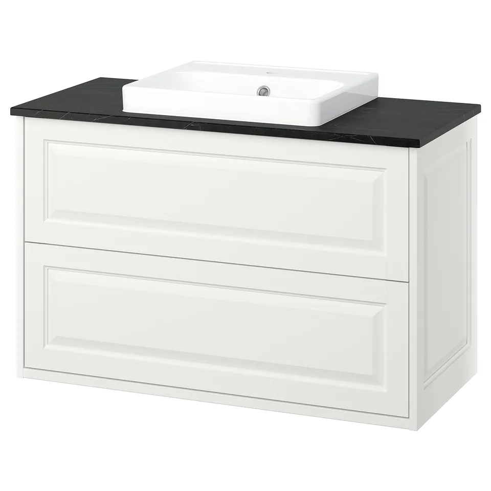 A white tånforsen wash-stand with a black countertop and a square ceramic sink. It two drawers and bevelled edges for a classic look.
